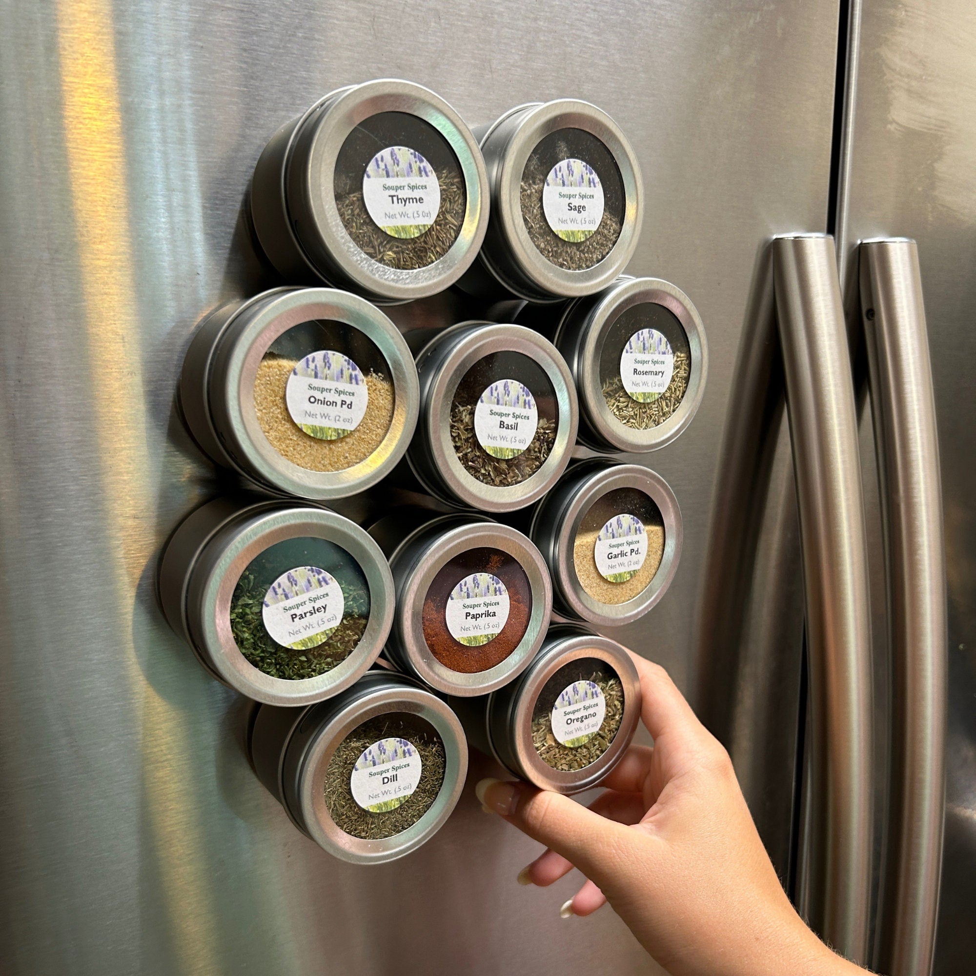 a refrigerator with magnetic spice jars filled
